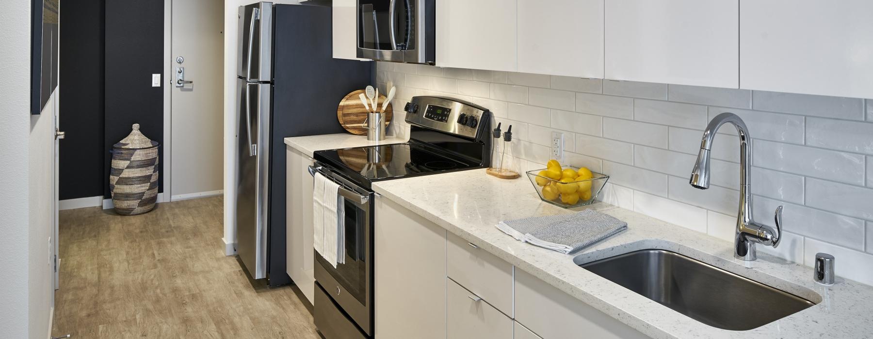 a kitchen with white cabinets